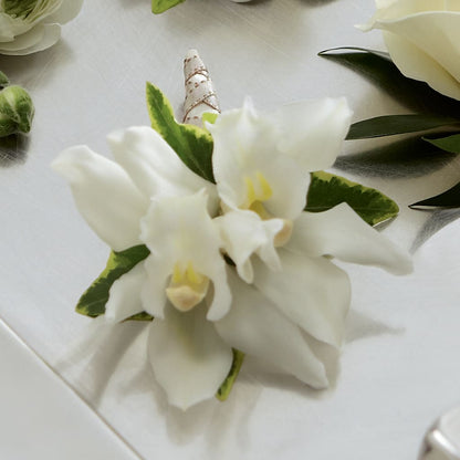 White Mini Cymbidium Boutonniere – GEHRKE FLORAL & GREENHOUSES, Mondovi WI